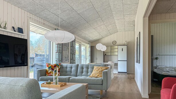 A modern living room with a grey sofa, a wooden coffee table, and a red chair. - Nice home in Oksbøl with WiFi (Oksbøl)