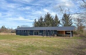 A two-story building with a dark roof and large windows. - Nice home in Oksbøl with WiFi (Oksbøl)