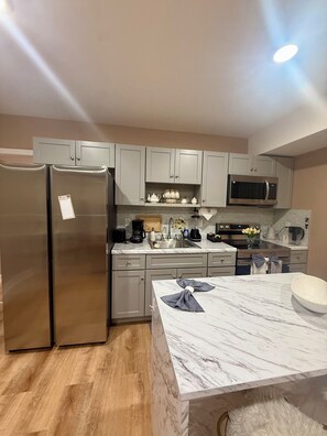 Fridge, microwave, oven, stovetop - Luxe 2BR Apt. w/ backyard Near Airport + Hospital (Newark)