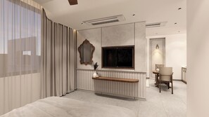 A modern hotel room with a bed, a TV, a seating area, and a bathroom. - Regenta Place Hitech City, Hyderabad – A Royal Orchid Hotels Brand (Hyderabad)