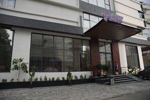 A modern building with a large entrance, a covered walkway, and a sign that reads 'REGEN-TA Place'. - Regenta Place Hitech City, Hyderabad – A Royal Orchid Hotels Brand (Hyderabad)
