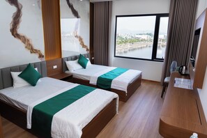 A hotel room with two beds, a large window, and a view of a body of water. - 12 Ao Ca Hotel (Bai Chay)
