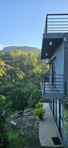 Unwind in secluded luxury at The Ridge House. Perched high above the Kandy,
