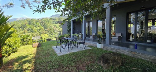 Unwind in secluded luxury at The Ridge House. Perched high above the Kandy,