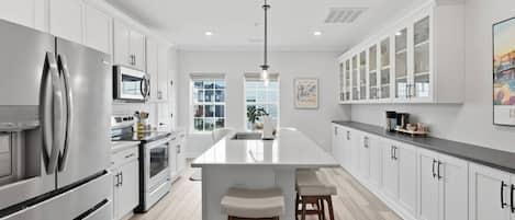 Coffee/tea maker, fridge, microwave, oven