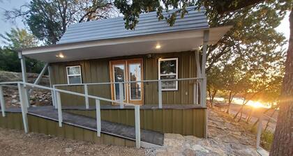 Charming Lakefront Cabin with Sandy Beach Access & Fire Pit Near Lake Cisco, TX