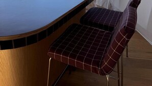 A tent with a wooden bar and checkered seating. - Cosmic Intimacy: Geodesic Dome Escape for Couples in a Dreamy Michigan Setting (Boyne Falls)