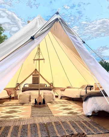 Bed sheets. Dreamy Nights with Loved Ones: Big Bell Tent Family Getaway in Michigan