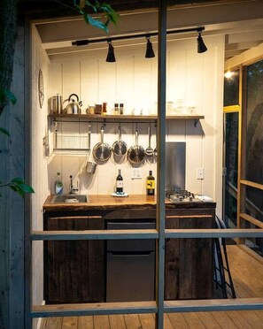 Fridge, stovetop, coffee/tea maker, cookware/dishes/utensils