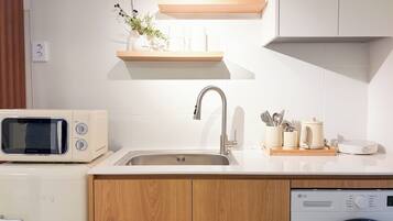Fridge, microwave, electric kettle, cookware/dishes/utensils