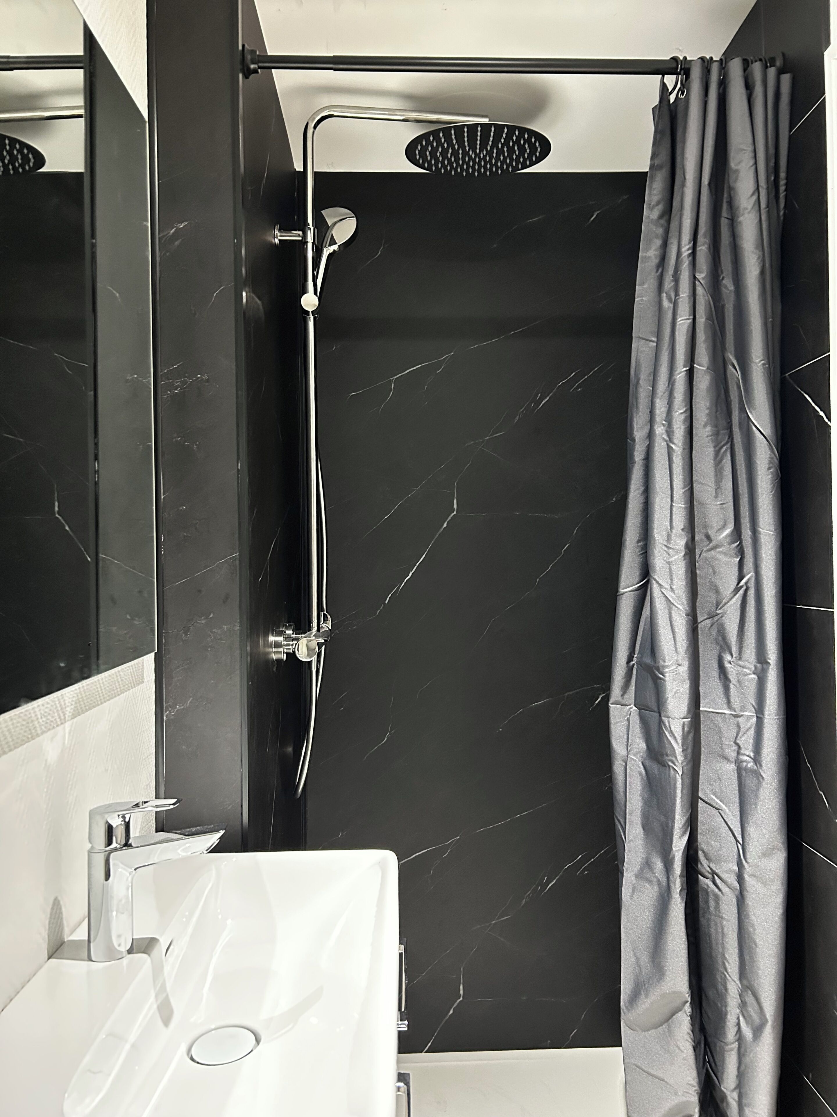 Shower, hair dryer, towels, toilet paper
