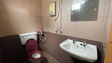 Standard Room, No Windows | Bathroom | Shower, free toiletries, hair dryer, slippers