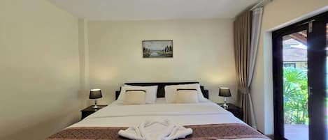 Family Room | Minibar, in-room safe, desk, blackout drapes