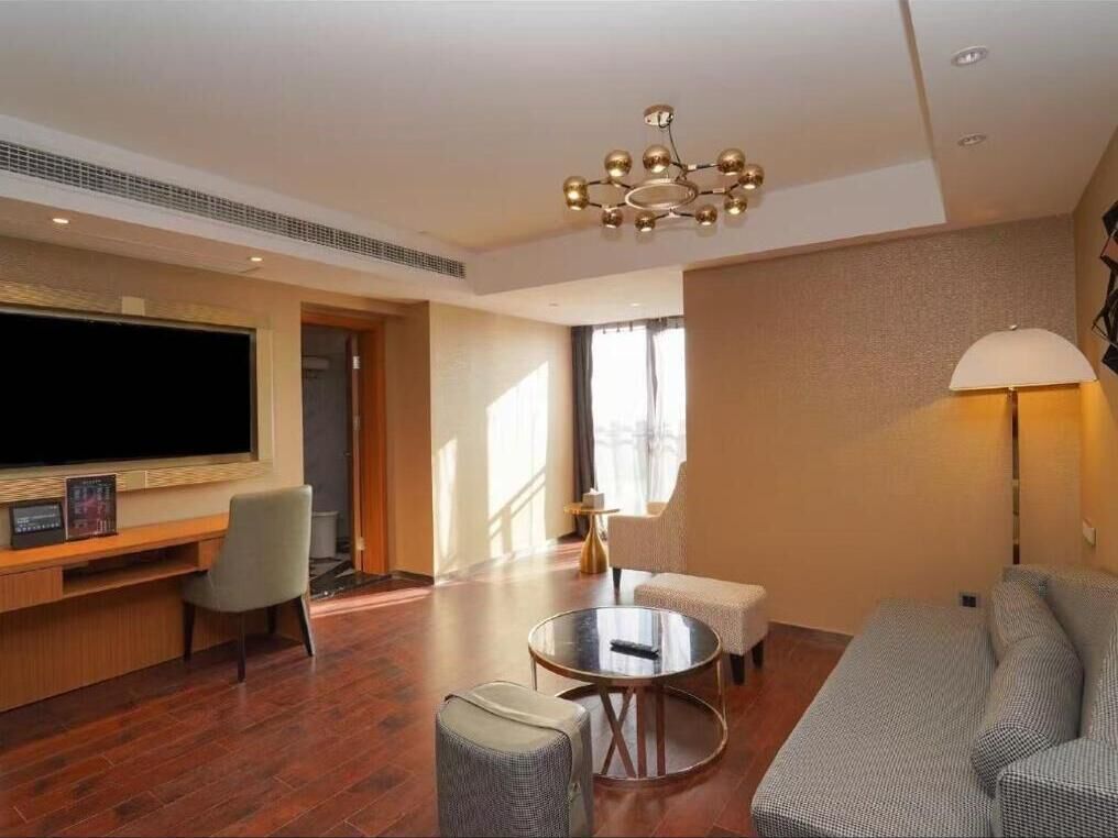 Suite, City View | Living area | 65-inch LCD TV with digital channels, printers