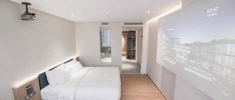 Premium bedding, down comforters, memory foam beds, free minibar