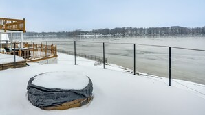 A snow-covered deck with a view of a frozen river and distant trees. - Lakefront Home w/ Views, 7 Mi to Dtwn Paw Paw (Paw Paw)