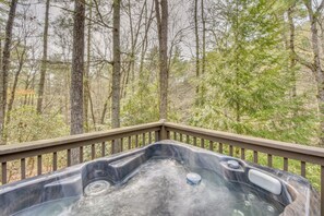 A hot tub on a deck with a forest view. - Private Hot Tub! Book-Lovers' Blue Ridge Retreat (Blue Ridge)