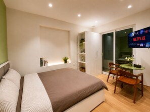 Superior Studio | Living area | 55-inch Smart TV with digital channels - Joy Apartment Pearl West Lake (Tay Ho)