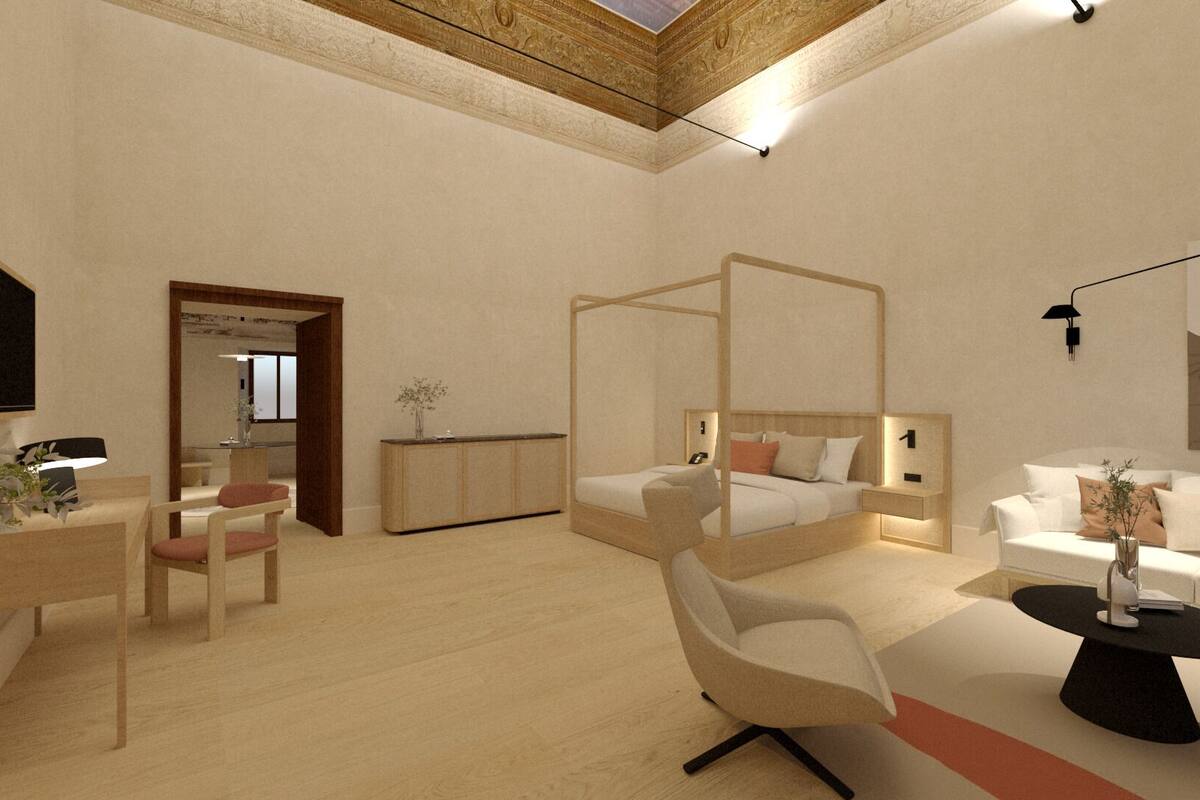 Un dormitorio moderno con una cama con dosel, un sofá, un escritorio con silla y una mesita de noche.