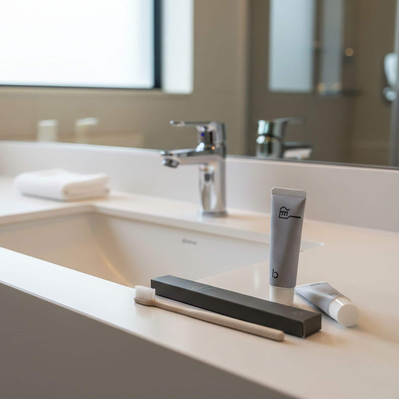 Combined shower/tub, hair dryer, slippers, towels