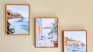 Three framed coastal scenes on a wall. - Modern 2BR Home w/Driveway | Sleeps 6 (Lincoln)