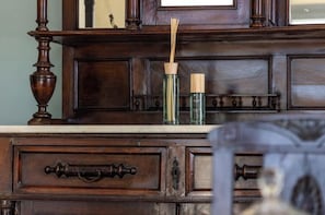 A wooden dresser with drawers and a mirror. - Harites Home – Sea View Villa A | Peaceful Island Escape with Stunning Views (Milos)