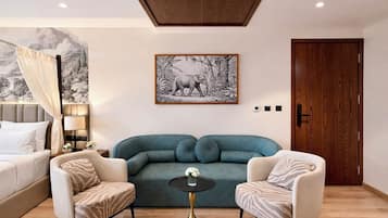 Suite estudio de lujo, cocina básica | Zona de estar