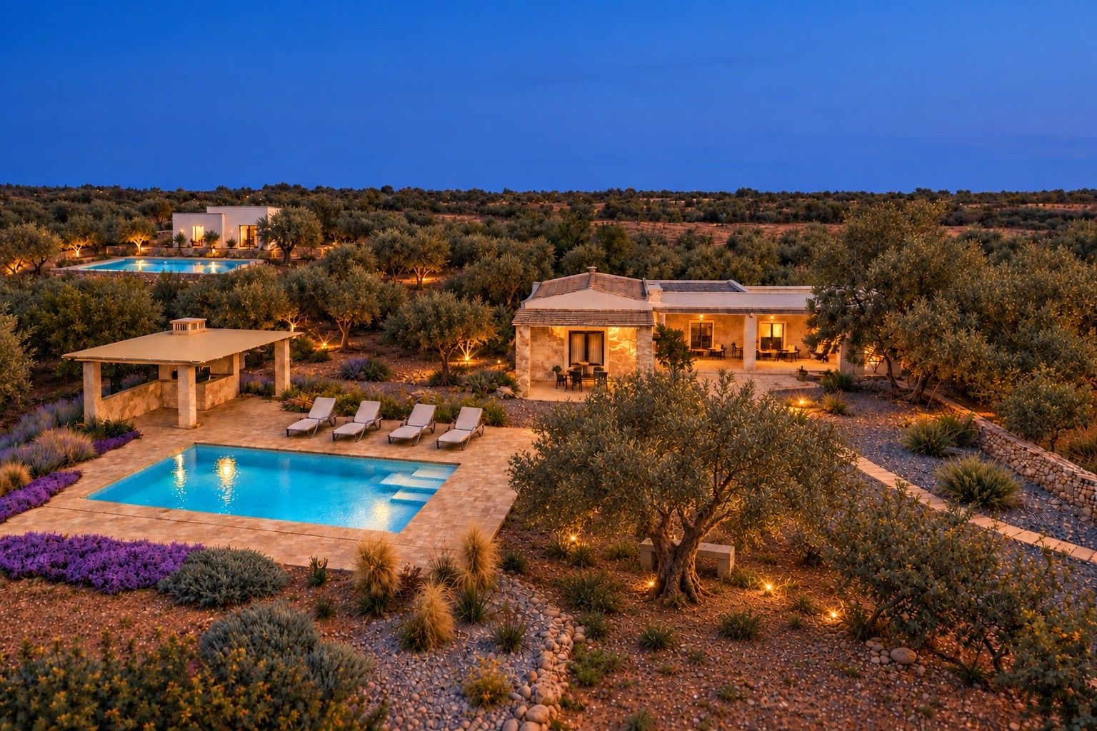 A villa with a swimming pool, outdoor seating, and a landscaped garden.