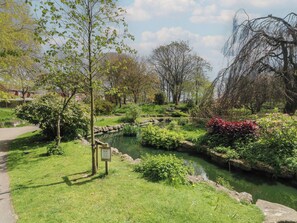 A park with a pond, pathways, and various trees. - Apartment 3 (Lytham St. Anne's)