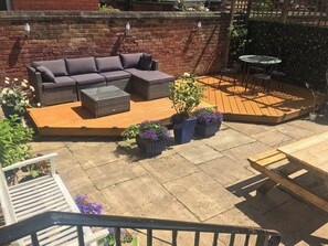 A patio with a sofa, planters, and a table. - Apartment 2 (Lytham St. Anne's)