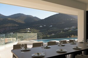 Outdoor dining - Artio Villa, Timeless Design Steps to Beach & Dine (CQ6J+WGM Bali, Greece)