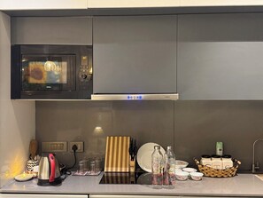 Fridge, microwave, oven, stovetop - The Spiral Nest - Supernova Spira -The Luxury Studio Apartment (Noida)