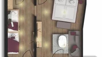 Un plan d’étage d’une chambre d’hôtel comprenant un lit, un bureau, une chaise, une petite table, un canapé, une télévision et une salle de bain.