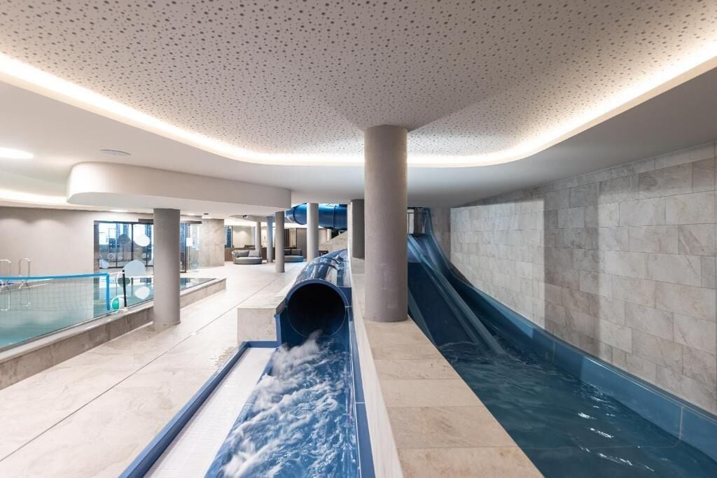 2 indoor pools, outdoor pool, open 7:00 AM to 8:00 PM, pool loungers
