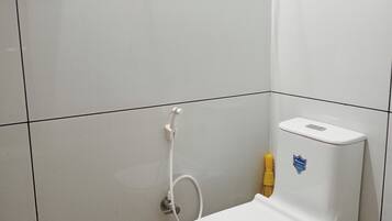 Shower, towels, soap, toilet paper