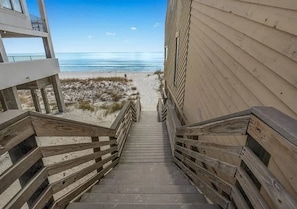 A wooden staircase leading to a beach with a clear view of the ocean. - Crystal Beach Home With Private Pool Walk to Beach (Destin)