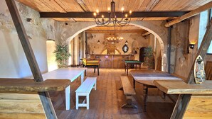 A rustic interior with wooden beams, a chandelier, and a billiards table. - Domaine de la Francoise (Dieulefit)
