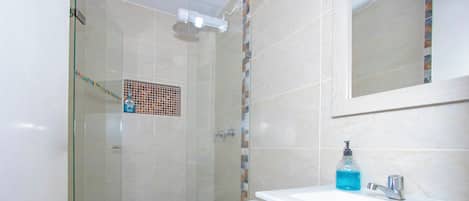 Shower, towels, soap, toilet paper