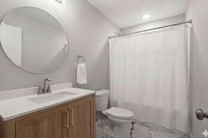 Shower, hair dryer, towels, shampoo