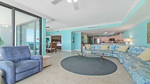A spacious living area with a sofa, armchair, and a coffee table. - Beachfront 3BR at Phoenix IX!  New to the Rental Market! (Orange Beach)