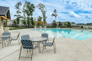 A swimming pool with lounge chairs and a covered seating area. - Pool & Dog Park Access! Porter Family Home w/ Yard (Porter)