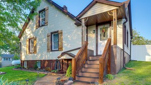 A two-story house with a front porch, a wooden staircase, and a small front yard. - Missouri Wine Country Retreat w/ Hot Tub & BBQ (Imperial)