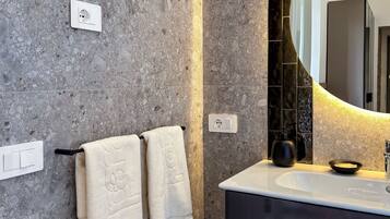 Suite, Garden View | Bathroom | Shower, hair dryer, towels, soap