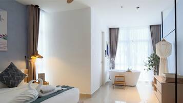 Premium One Bedroom Bathtub Suite | Individually decorated, individually furnished, desk, blackout curtains