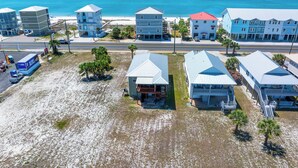A coastal area with buildings, a road, and a beach. - 🏖️Steps to Beach | Great Outdoor Spaces | Perfect for Families | Beach Dreams☀️ (St. Joe Beach)