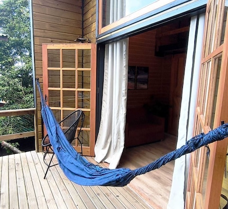 Terrace/patio. Tucano Chalet with sea and nature views of Solidão Beach