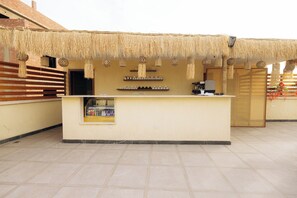 A reception area with a counter, hanging decorations, and a tiled floor. - 5 min to the Great Pyramids of Giza , big clean tidy rooms (Giza, Cairo, Egypt)