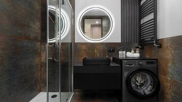 Shower, hair dryer, towels, shampoo