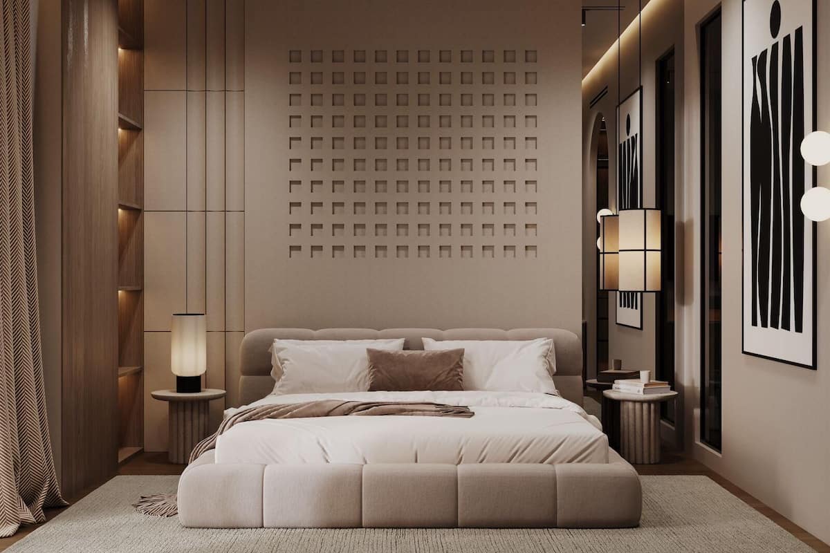 A modern bedroom with a large bed, bedside tables, a wall-mounted light fixture, and a patterned wall.