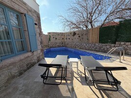 Seasonal outdoor pool, open 11:00 AM to 6:00 PM, sun loungers